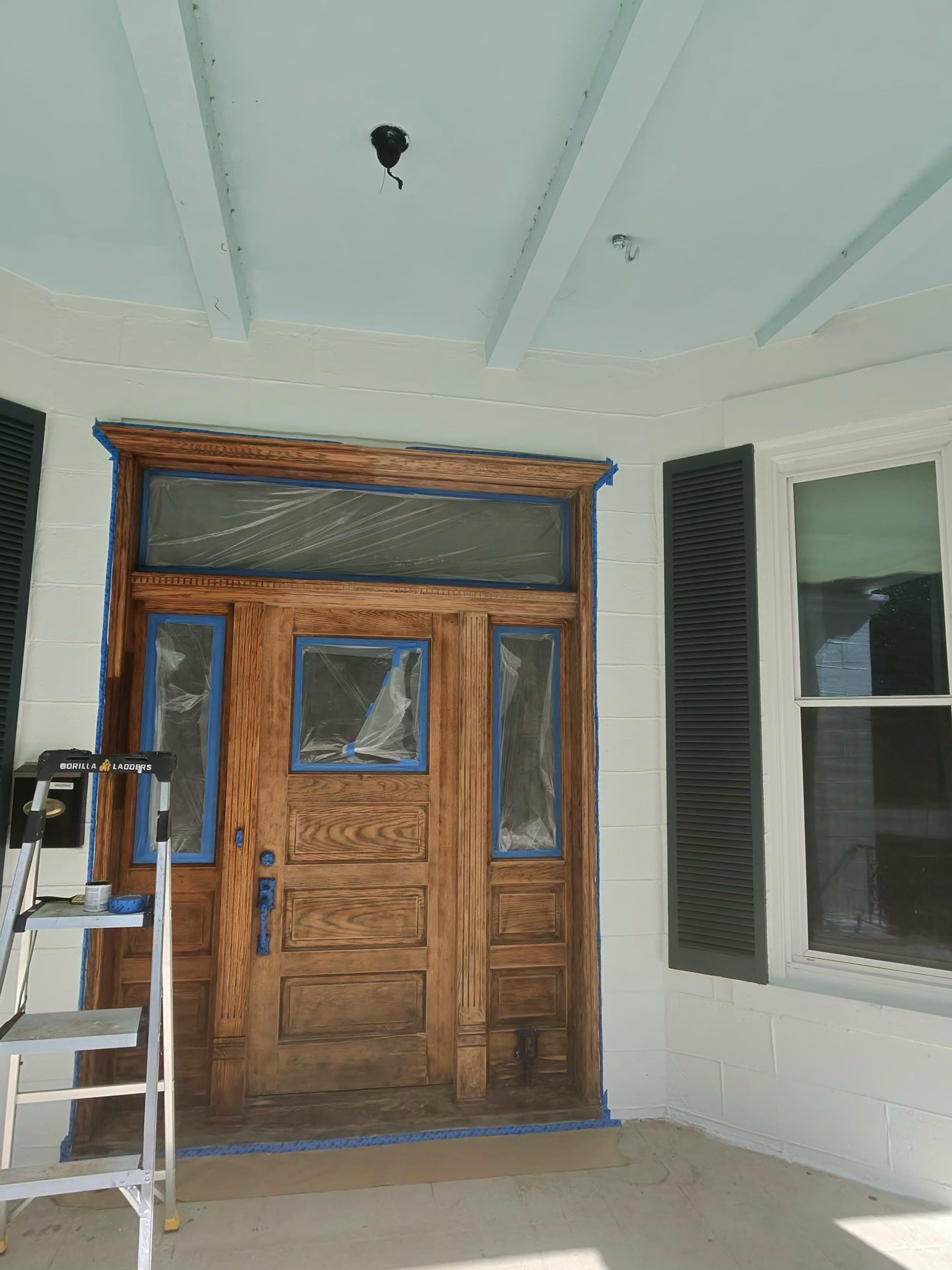 Before and after wood stain refinish on grand entry door, Austin TX